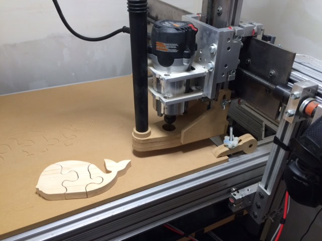 James built a CNC machine, he got it back up and running after two year, almost three, and buiilt Hazel a cool toy whale, I will paint it at some point for her!