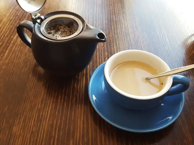 Milk Tea Poured To A Blue Ceramic Cup Milk Tea Poured To A Blue Ceramic Cup