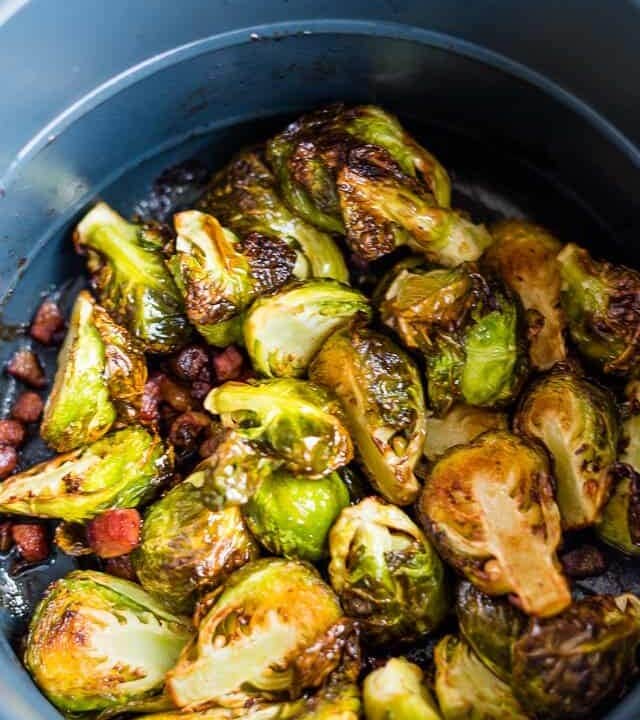 air fryer Brussels sprouts in the basket of the instant pot air fryer lid with pancetta