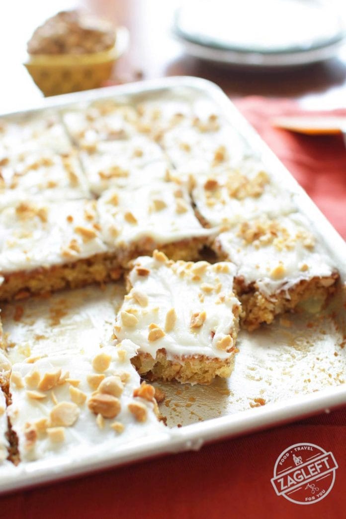 Pineapple Peanut Mini Sheet Cake Recipe - this wonderful sheet cake is filled with bits of sweet crushed pineapples and crunchy peanuts; a surprisingly wonderful combination! Baked in a quarter sheet pan and topped with a rich cream cheese frosting, this cake is perfect for serving just a few people. | One Dish Kitchen