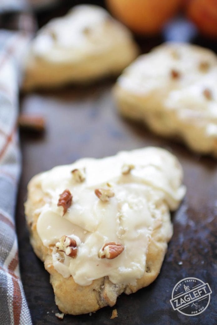 This wonderful Apple Cinnamon Scones recipe will yield 4 buttery, tender scones. Made with fresh apples and toasted pecans and each scone is topped with a delightful maple glaze. | One Dish Kitchen