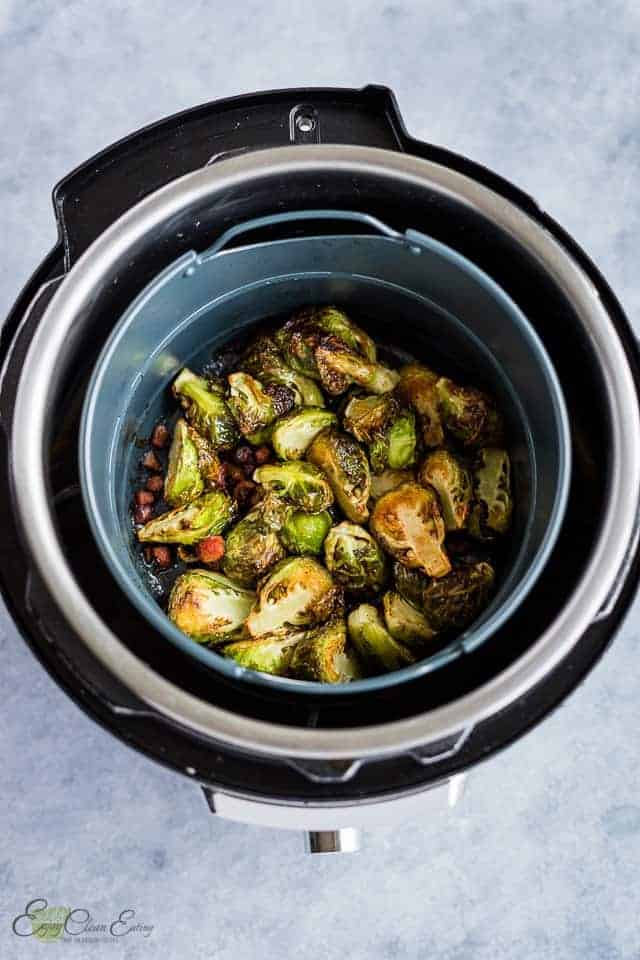 fully cooked sprouts in the basket and the instant pot.