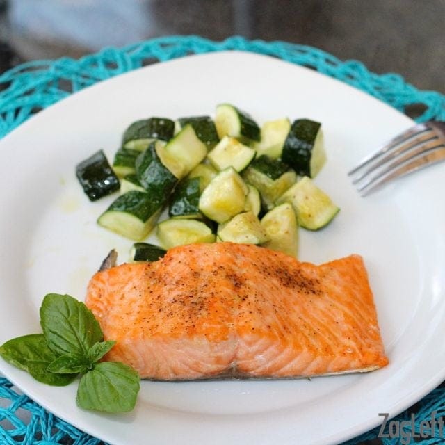 Broiled Salmon and chopped Roasted Zucchini on a plate