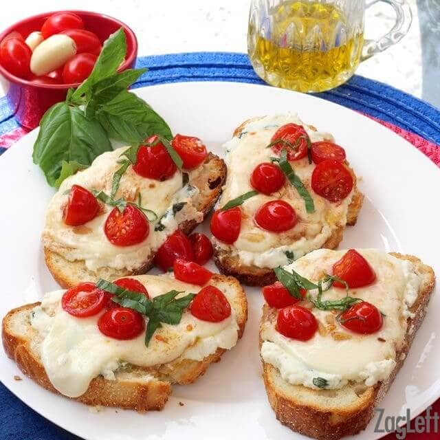 Four slices of Caprese Toast on a plate
