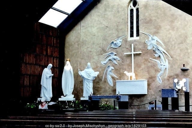 Gable end of the church in Knock with white states and an altar as a shrine to the Virgin Mary