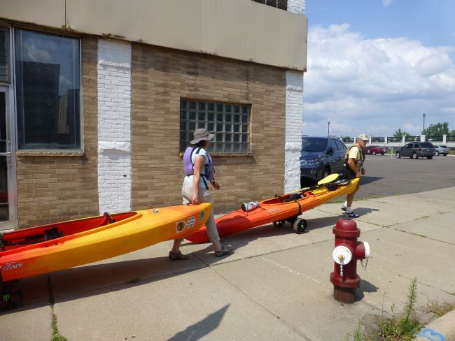 Portaging kayaks through downtown Minneapolis.
