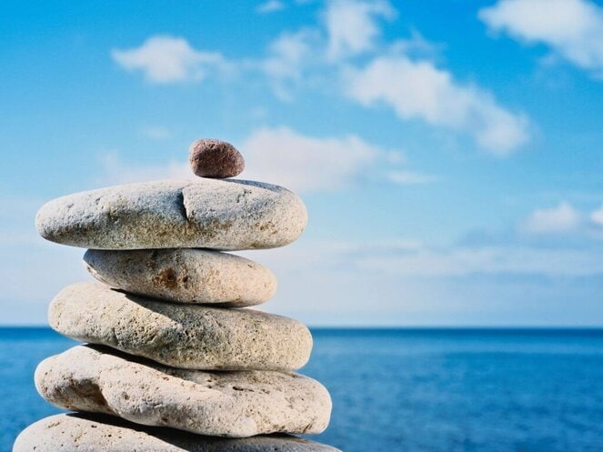 pebbles by a claming beach to stay positive