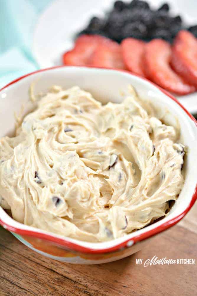 bowl of fruit dip with sliced strawberries