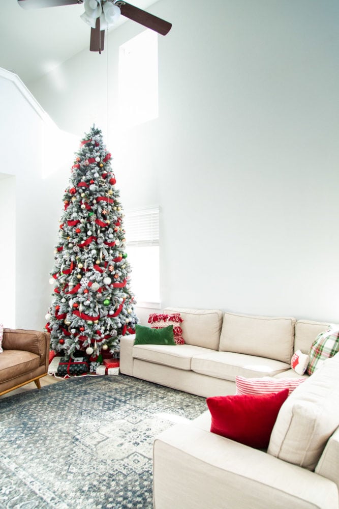 view of IKEA KIVIK sofa with a tall Christmas tree