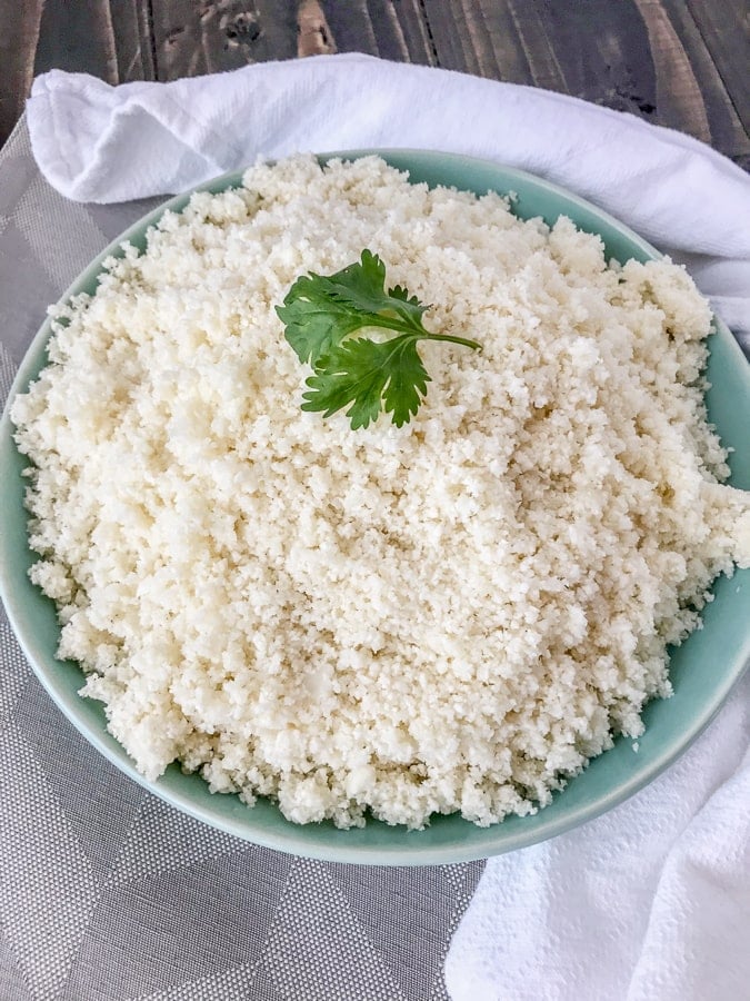 How To Make and Freeze Cauliflower Rice - this is the perfect healthy, low-carb alternative to rice, quinoa, or pasta. Being that it contains only one ingredient, it is perfect forĀ almost any meal plan and is also easier to make than you think! All you need is a knife with a cutting board and a food processor. #cauliflower #cauliflowerrice #howto #diy #doityourself #sidedish #healthy
