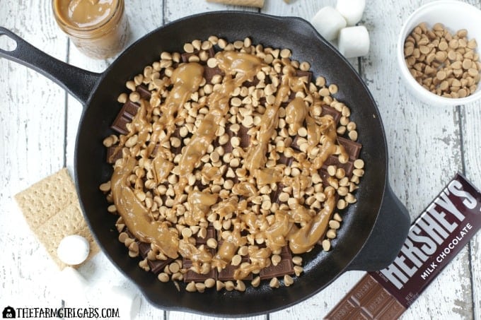 Chocolate Peanut Butter Skillet S'mores are an updated twist of the campfire classic. This recipe has the perfect amount of chocolate and peanut butter.