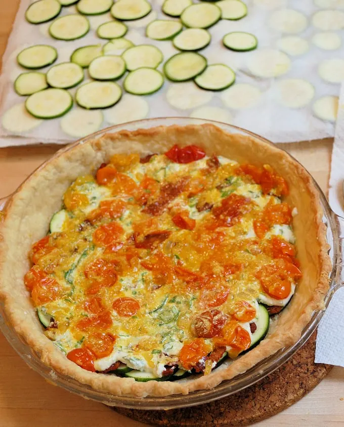 layering ingredients for zucchini pie