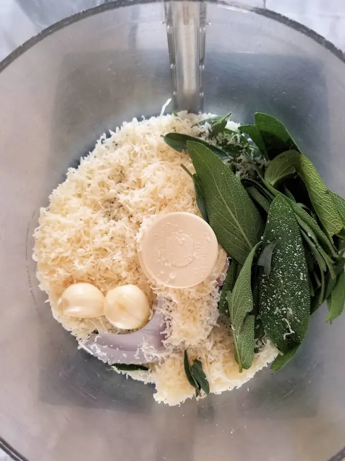 ingredients for sage pesto in a food processor