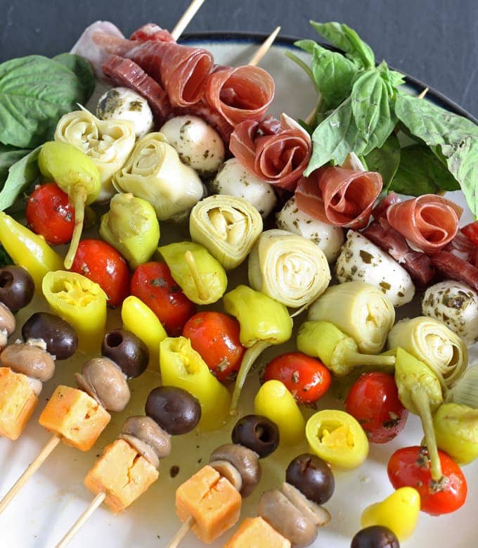 These antipasto skewers are the perfect lazy day appetizer. They can easily be made from store bought pickled items or from your pantry stash! | honeyandbirch.com