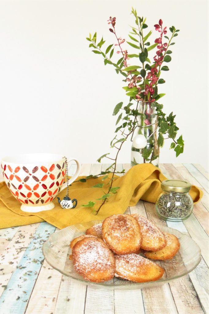 English Lavender Madeleines served on a plate with a cup of tea