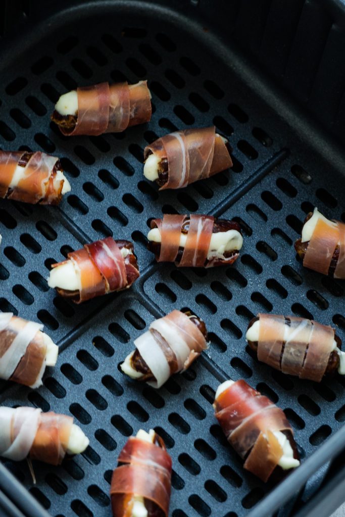 Before air frying stuffed brie cheese dates wrapped with prosciutto.