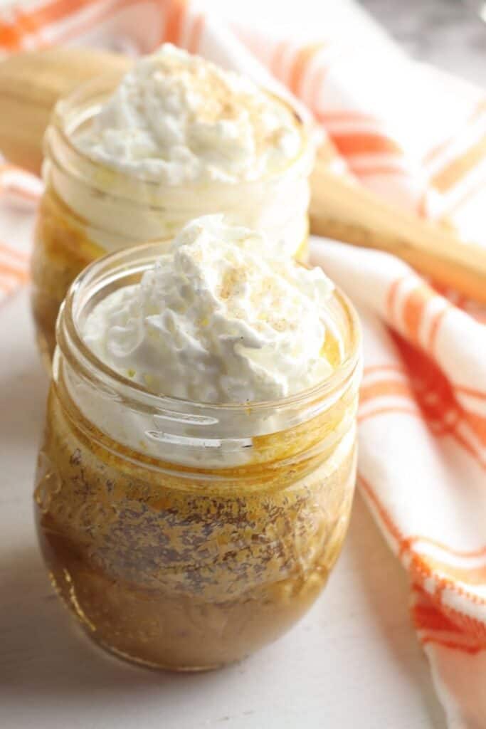 For the perfect easy fall mason jar dessert, this Pumpkin Pie in a Jar recipe is just what you need. Consisting of pumpkin puree and several other easy-to-find ingredients that you likely already have at home, this fall favorite is easy to make and delicious to taste. This pumpkin mason jar recipe is a tasty twist on the classic pumpkin pie recipe. This fall dessert is also a delicious Thanksgiving dessert recipe too.