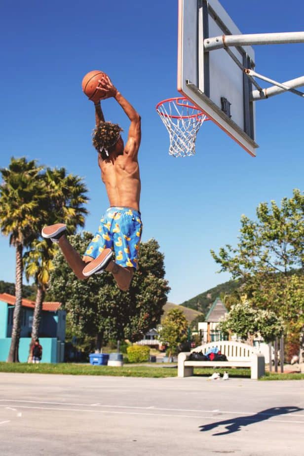 a guy playing basketball for his sports scolarship