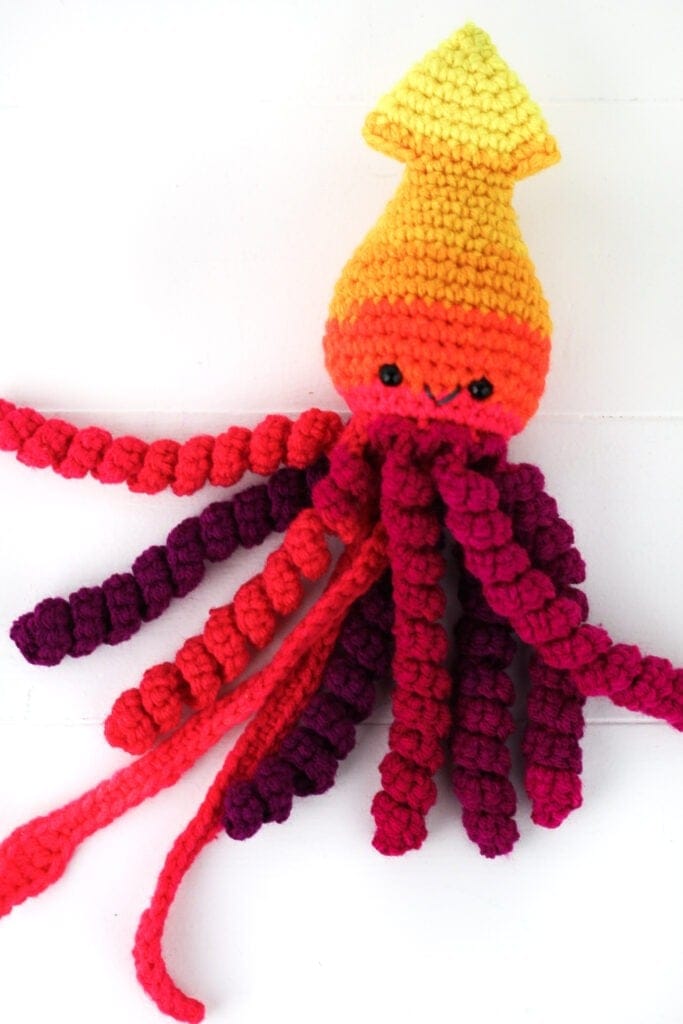 This preemie crochet squid pattern works up fast and is just adorable. Free crochet pattern for an amigurumi squid by Winding Road Crochet. #squid #crochetsquid #amigurumi #preemiecrochet