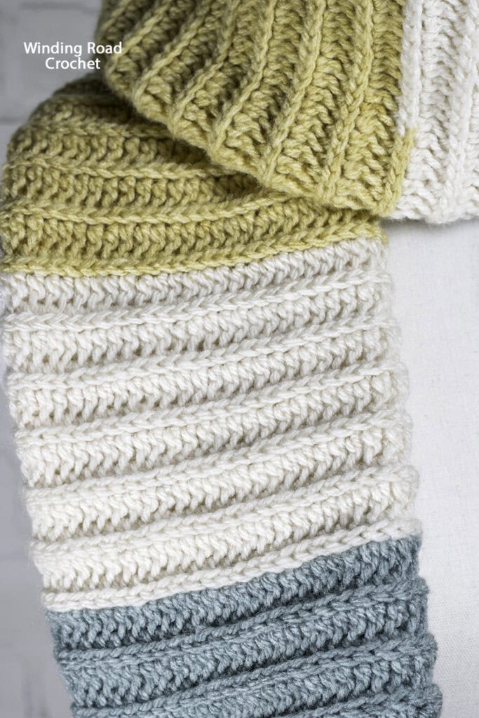 This easy crochet pocket infinity scarf is a clever way to combine the two popular scarf styles into one. Free pattern and video tutorial.