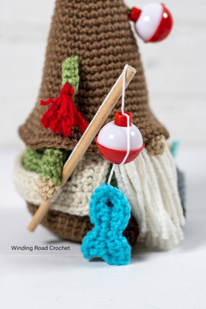 A crochet fishing gnome makes a great gift Father's day gift for a fisherman. This free crochet pattern will help you make an adorable gnome.