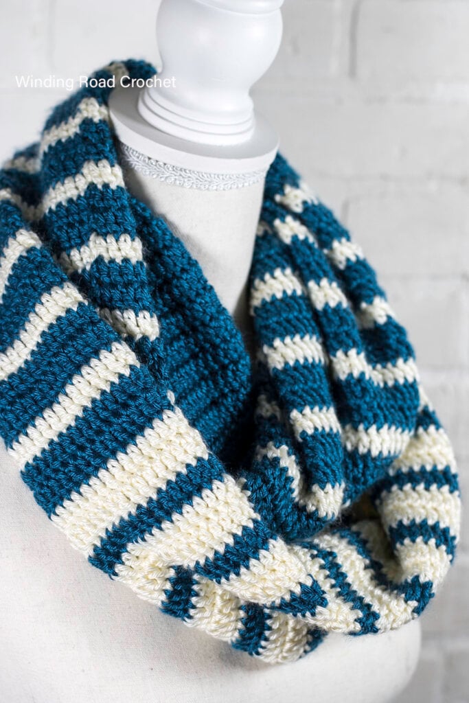 This is an easy striped crochet scarf pattern with a beautiful reverse striped design. Free crochet pattern for an unique infinity scarf.