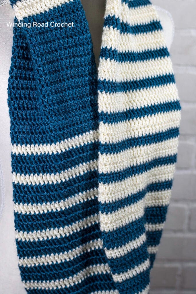 This is an easy striped crochet scarf pattern with a beautiful reverse striped design. Free crochet pattern for an unique infinity scarf.
