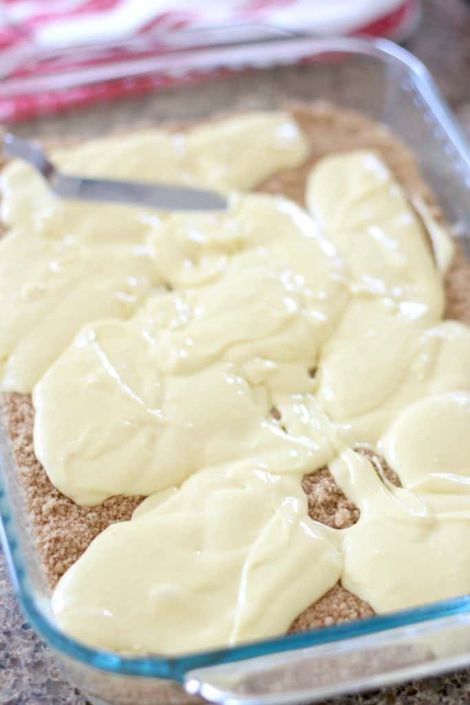 cake mix batter spread on top of brown sugar cinnamon mixture
