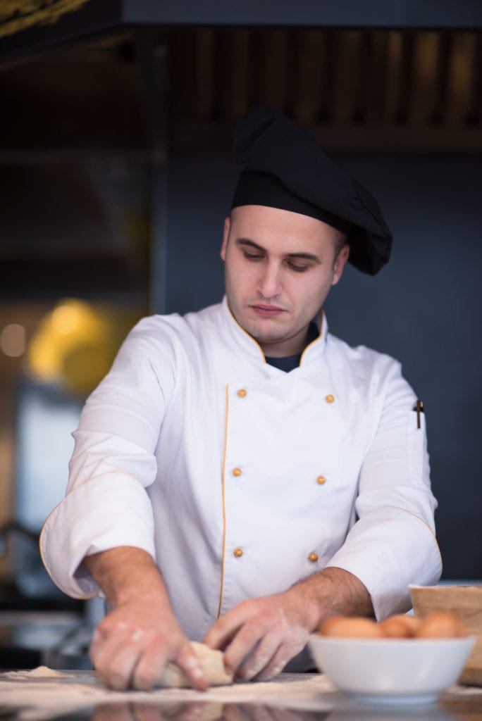 our pinsa chef preparing dough for roman pizza