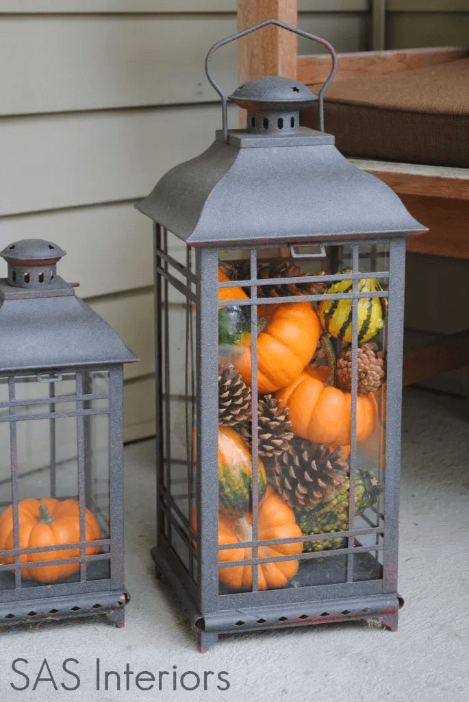 DIY PORCH DECOR IDEAS ON A BUDGET FOR FALL AND WINTER WITH LANTERNS FILLED MINI PUMPKINS