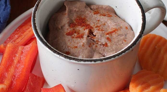 Quick and easy homemade Black Bean Hummus made with canned, rinsed and drained black beans. This small batch hummus recipe is made with just a few ingredients and is a delicious alternative to traditional chickpea hummus. Enjoy with raw vegetables, crackers or tortilla chips or spread on sandwiches. No tahini needed! | One Dish Kitchen