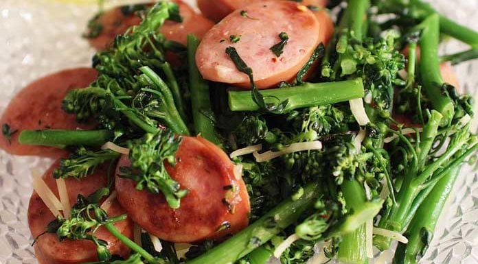 This simple recipe for Broccolini With Sausage For One is full of flavor. Steamed broccolini or broccoli sautéed in olive oil with sliced garlic and sausage. I wonderful meal that can be on your table in 30 minutes! | One Dish Kitchen