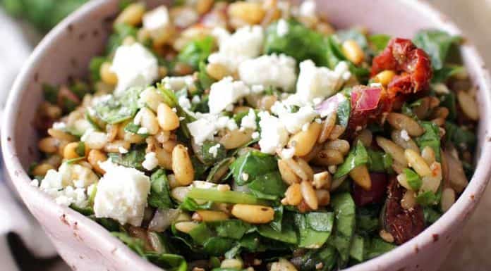 This easy to make Spinach and Orzo Salad For One is filled with creamy Feta cheese, toasted pine nuts, chopped red onions, sun-dried tomatoes and Kalamata olives. Tossed with a simple balsamic vinaigrette it's sure to become your very favorite single serving salad! | One Dish Kitchen
