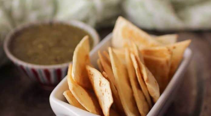 You just need 3 ingredients to make these homemade baked tortilla chips! They're crisp and delicious and can be ready in minutes. Perfect to enjoy with a dip, with cheese, or alone as a crunchy snack. You'll never go back to store brands when you can make tortilla chips this easily at home. | One Dish Kitchen