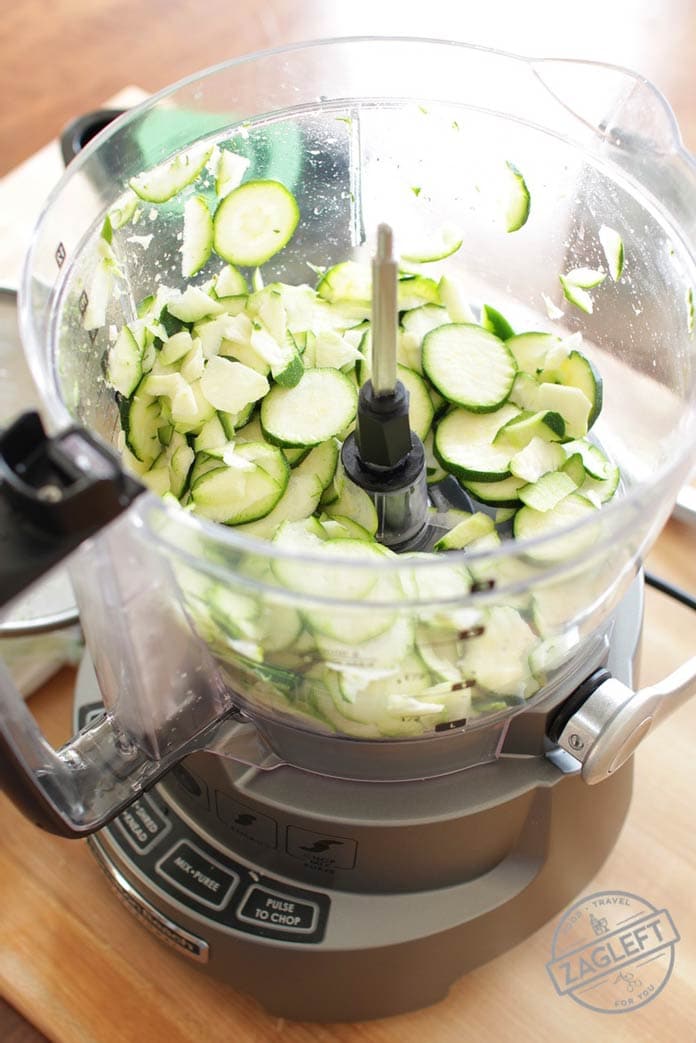 Sliced zucchini in a food processor