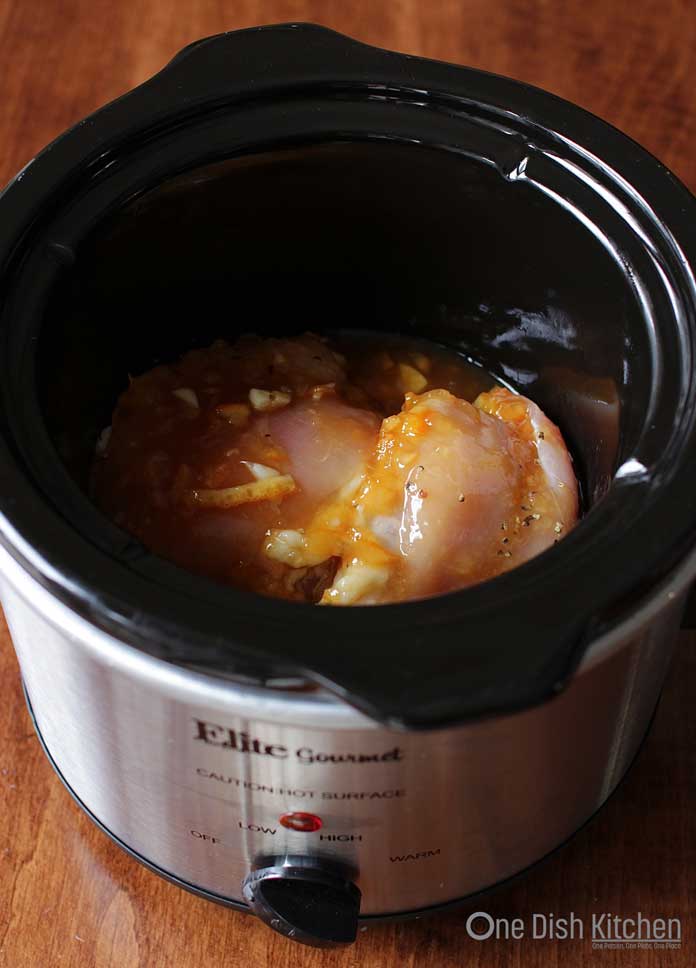 chicken inside a small slow cooker | One Dish Kitchen