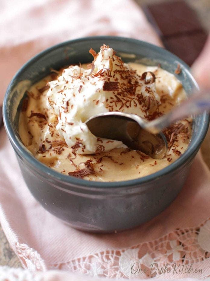 a spoon in a small peanut butter pie.