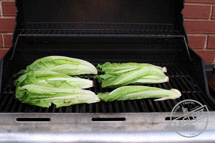 Romaine lettuce on the grill before turning - zagleft.com