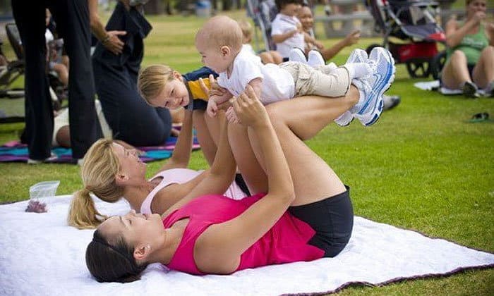 A group of young moms are practicing with their babies