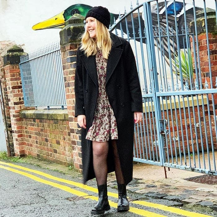 Kerri in a black beanie and matching coat | 40plusstyle.com
