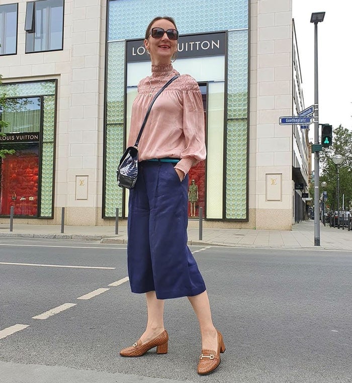 Sabina wears navy with tan accessories | 40plusstyle.com