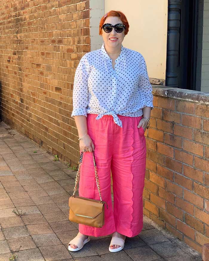 wearing a bright pair of elastic waist pants with a polka dot blouse | 40plusstyle.com