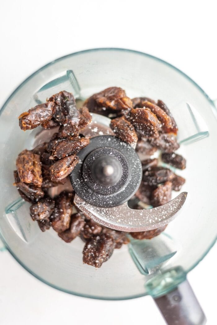 Pitted dates in a food processor with sea salt.
