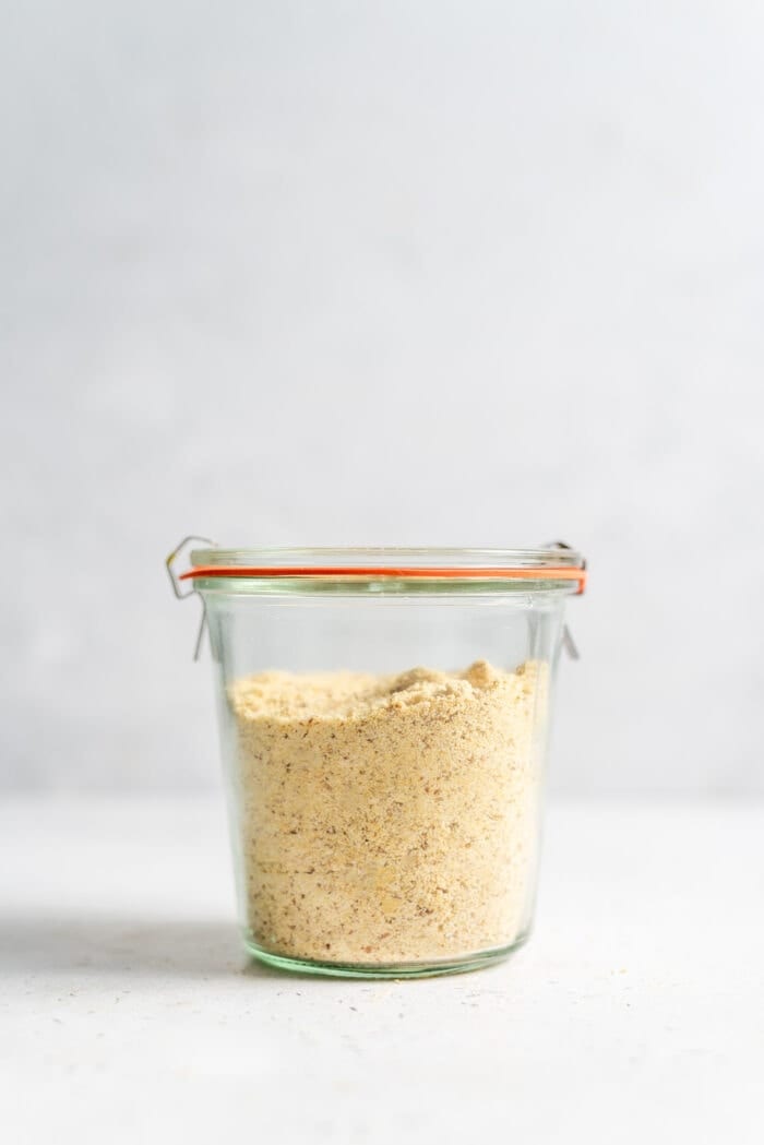 Sealed Weck jar filled with vegan parmesan cheese.