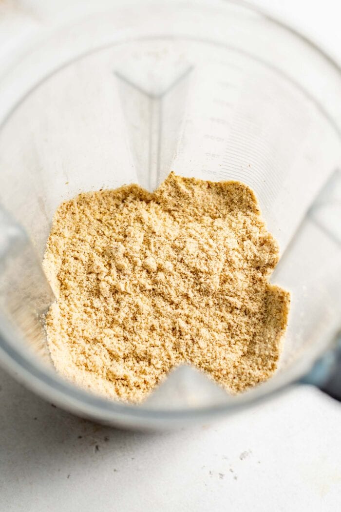 Blended vegan parmesan cheese in a blender.