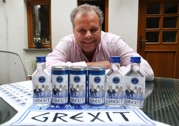 epa04816115 47-years old German businessman Uwe Dahlhoff poses behind products labeled with 'Grexit' in Hamm, Germany, 23 June 2015. Next week Dahlhoff wants to roll out a lemon vodka liqour with the brand name 'Grexit'. The term Grexit refers to the possibility that Greece leaves the Eurozone and combines Greece and exit. EPA/INA†FASSBENDER