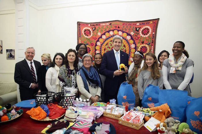 U.S. Secretary of State John Kerry poses for a photo with workers at the Melissa Network, a migrant aid group staffed by former migrants, while in Athens, Greece.