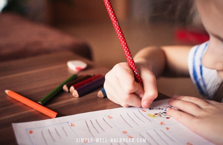 image of child sharing a pencil at school