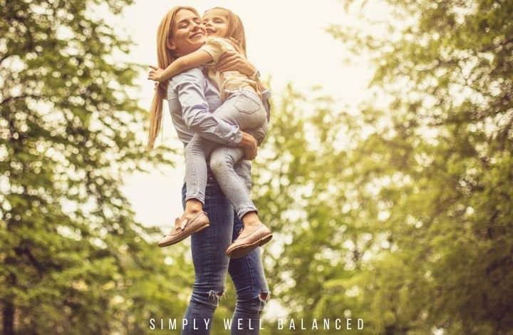 Bonding Moment:Mother and daughter hugging surrounding my trees.
