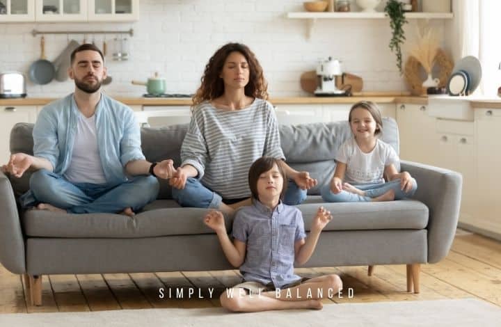 Family meditating on couch; create a peaceful home